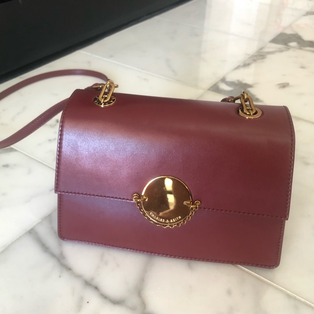 Charles and Keith burgundy cross body bag
